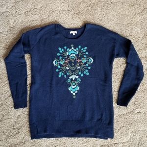 Navy pullover sweater with floral needlepoint stitching